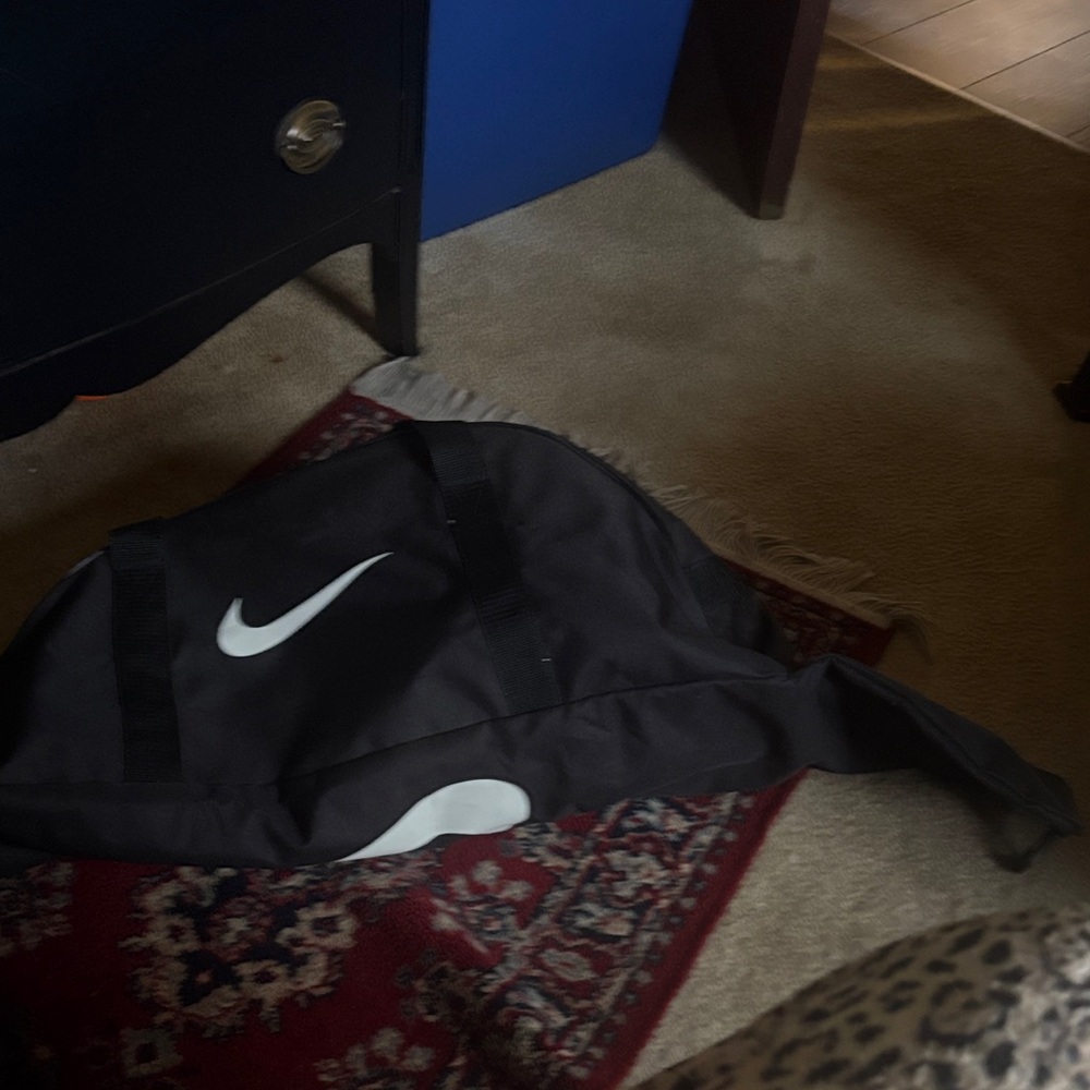 Nike Black Duffel Bag with White Swoosh